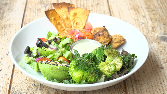 The top menu item at a popular cafe specializing in this healthy cuisine is a vegan plate of smoked paprika hummus. It's accompanied by tahini sauce and roasted falafel made with sweet potatoes and quinoa. 