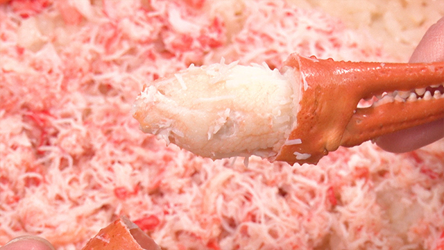 The savory rice is topped with shredded boiled crab and garnished with crab claws packed with sweet crabmeat.