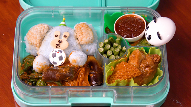 Jen makes a cute bear-shaped onigiri to finish her flavorful bento of Kare-Kare and a thick and salty shrimp paste.